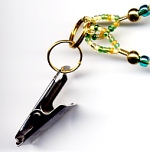 close-up of green badge clip
